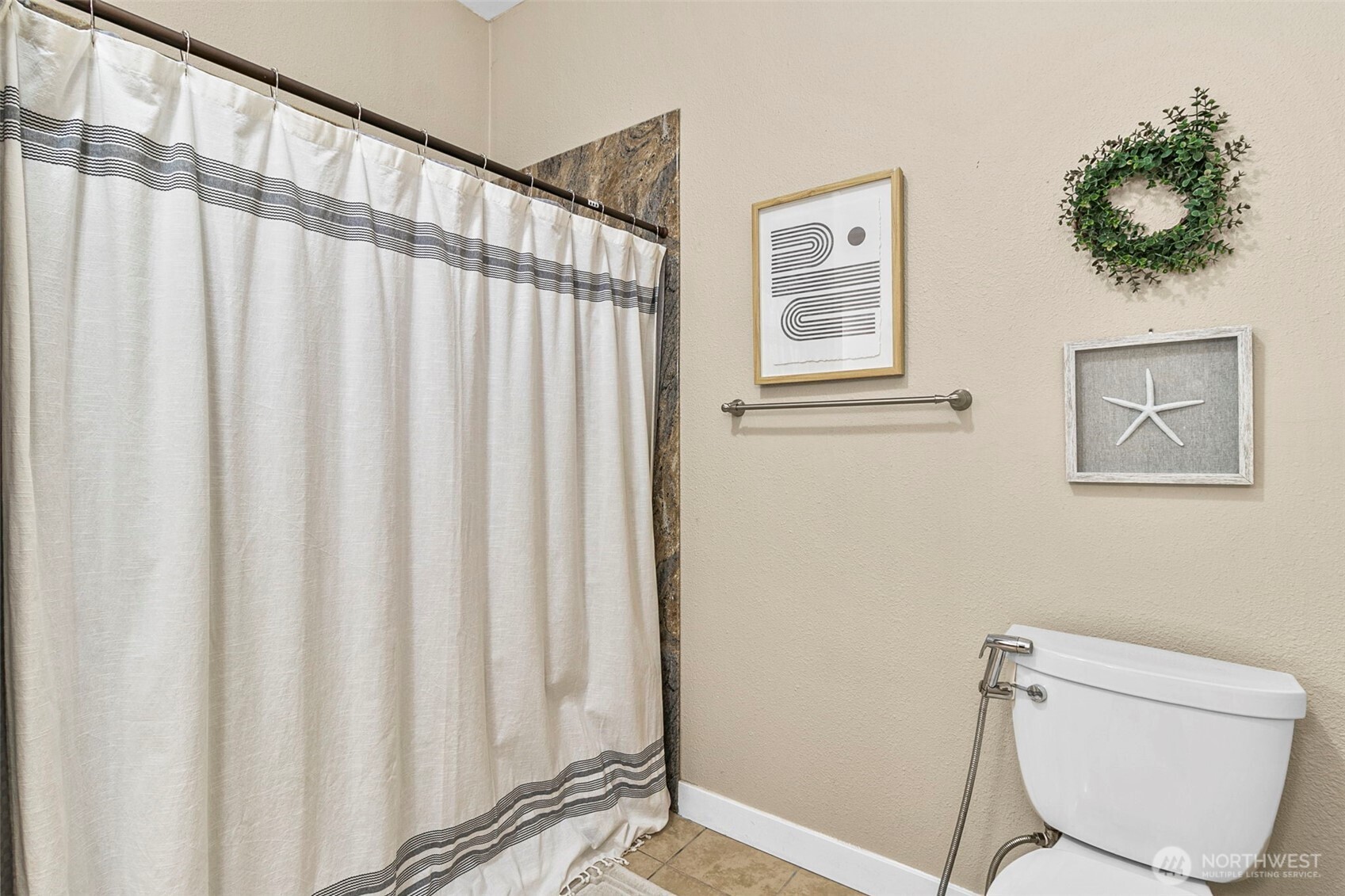 4416 South 315th Street Auburn, WA 98001 - Photo 32 of 37 a bathroom with a toilet and a shower curtain