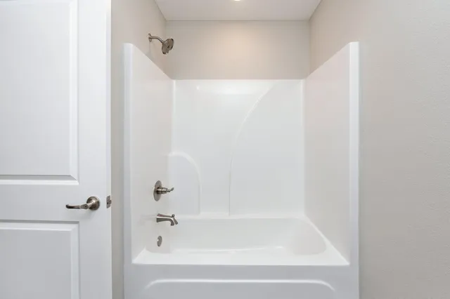 a close up of a bathtub in a bathroom