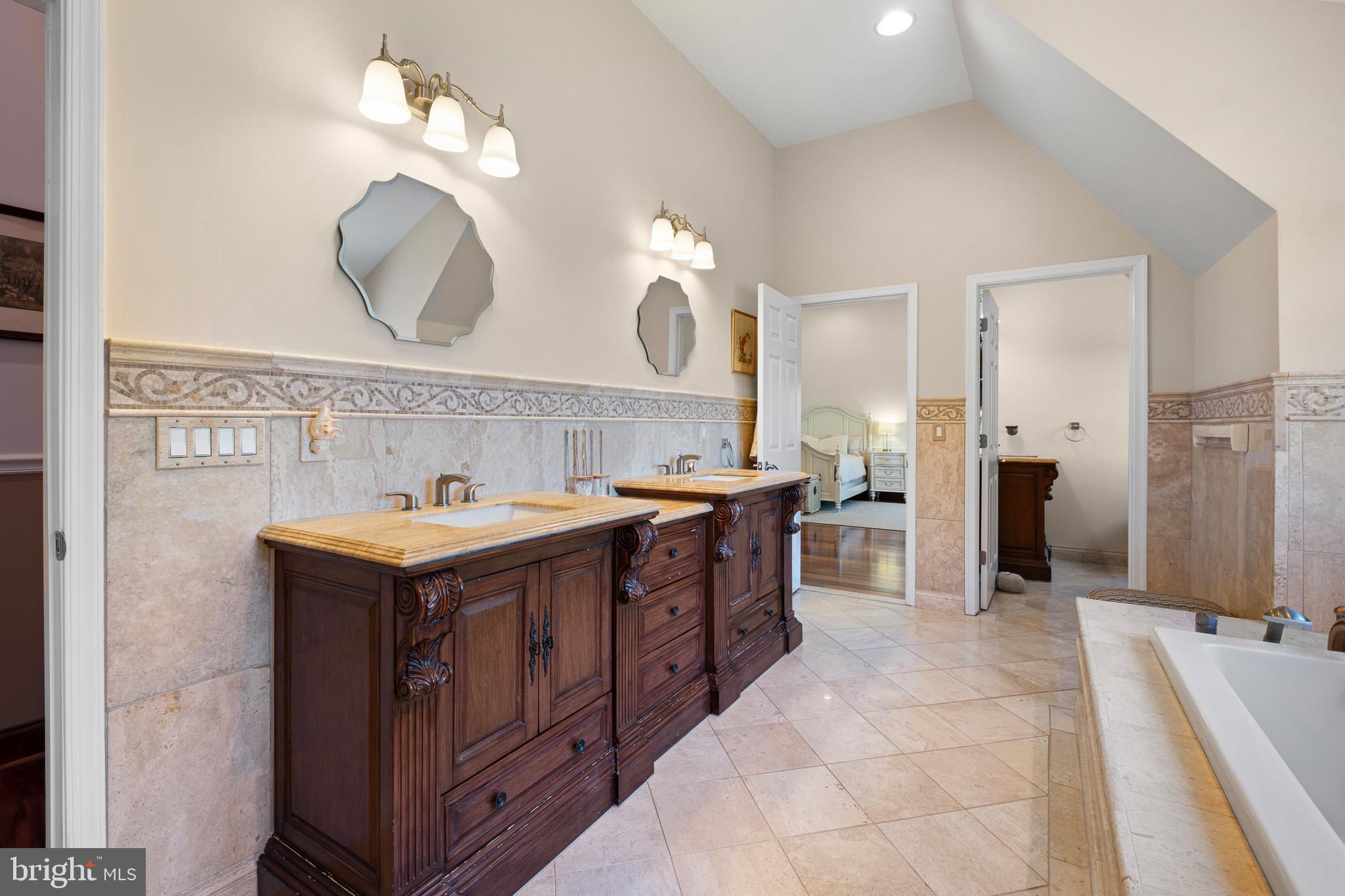 1114 Taylors Bridge Road Townsend, DE 19734 - Photo 51 of 77 a spacious bathroom with a sink double vanity and a mirror