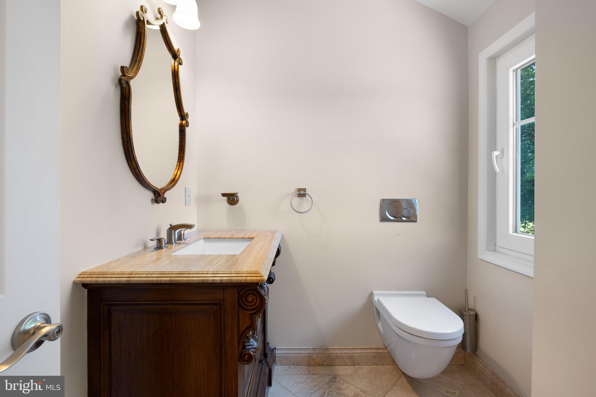 1114 Taylors Bridge Road Townsend, DE 19734 - Photo 53 of 77 a bathroom with a sink and mirror with toilet