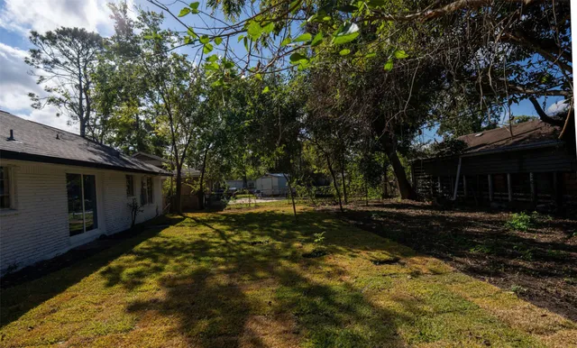 a backyard of a house with lots of green space