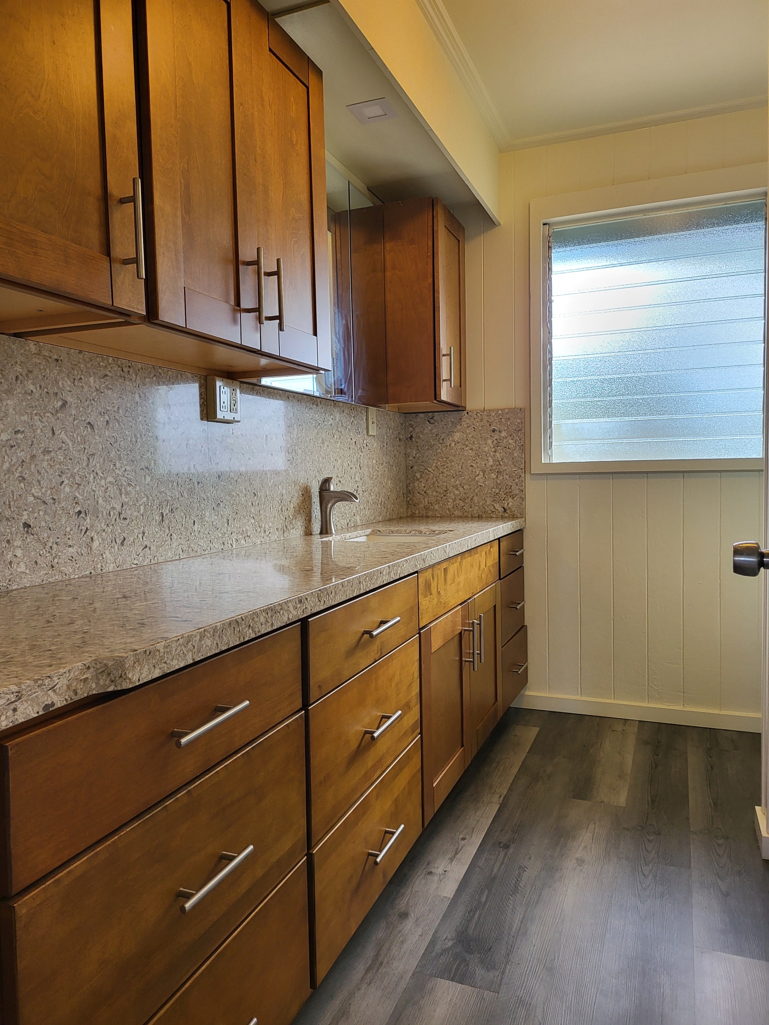 7976 Elepaio Road Kekaha, HI 96752 - Photo 12 of 30 a kitchen with stainless steel appliances granite countertop a sink a stove and cabinets