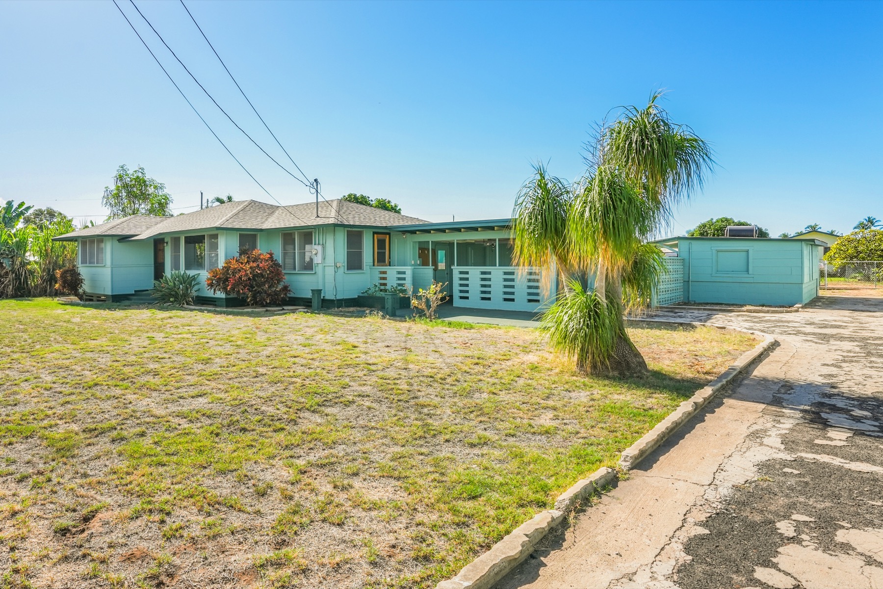 7976 Elepaio Road Kekaha, HI 96752 - Photo 22 of 30 a view of a house with a swimming pool