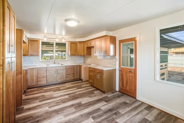 a kitchen with a sink and cabinets