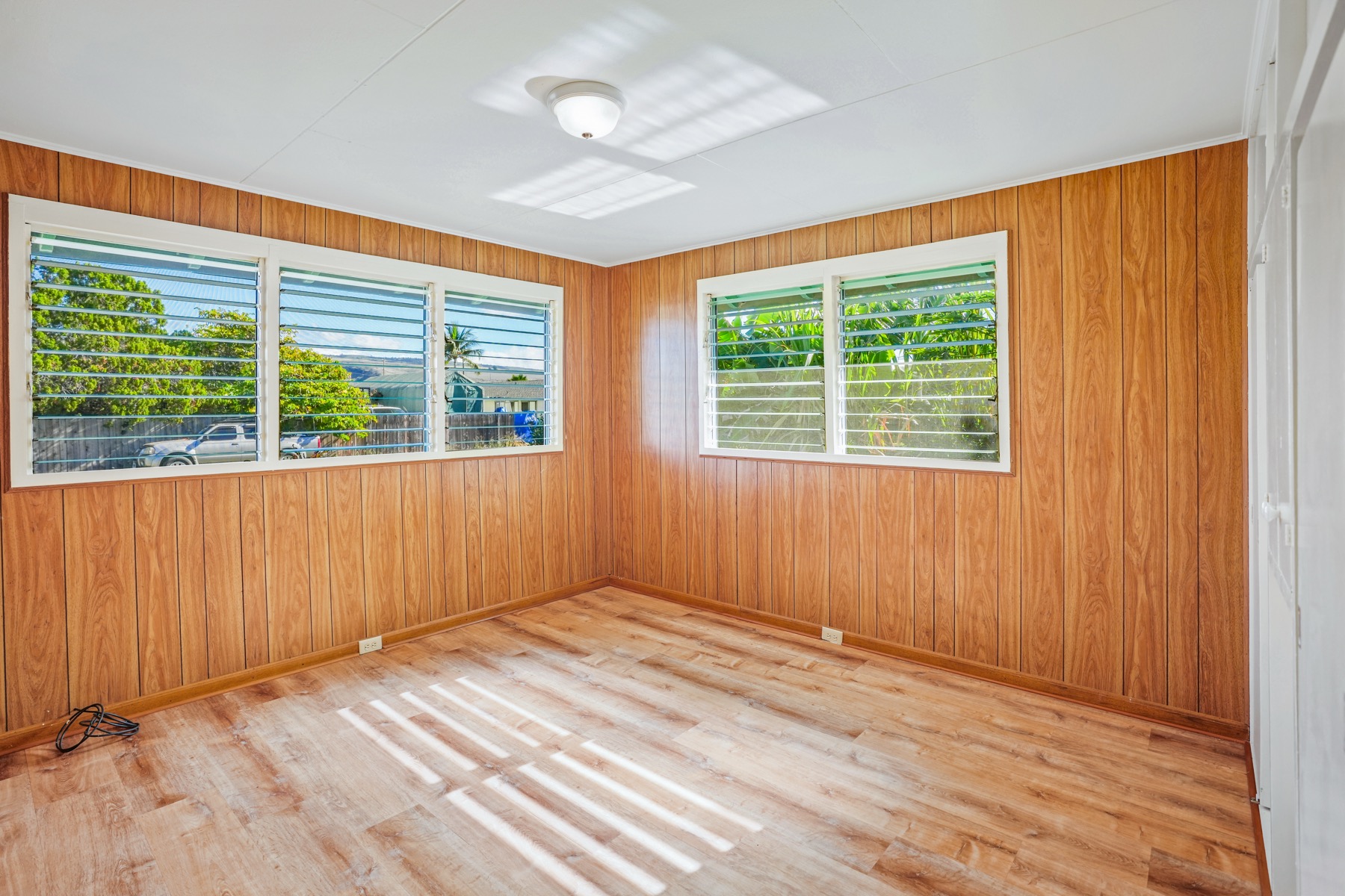 7976 Elepaio Road Kekaha, HI 96752 - Photo 7 of 30 an empty room with windows
