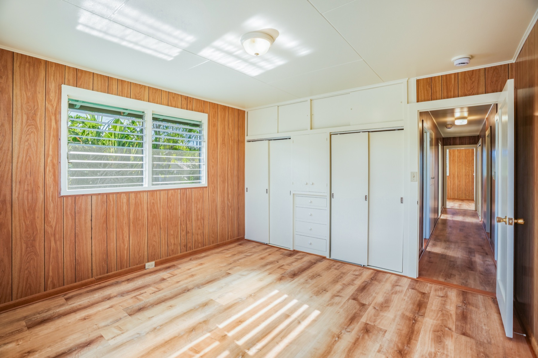 7976 Elepaio Road Kekaha, HI 96752 - Photo 8 of 30 a view of empty room with wooden floor and fan