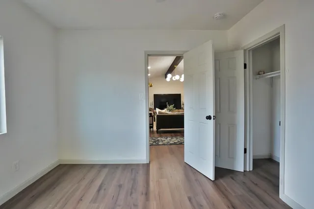 a view of a chair and table in the backyard