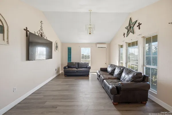 a kitchen with stainless steel appliances granite countertop a refrigerator a stove and sink