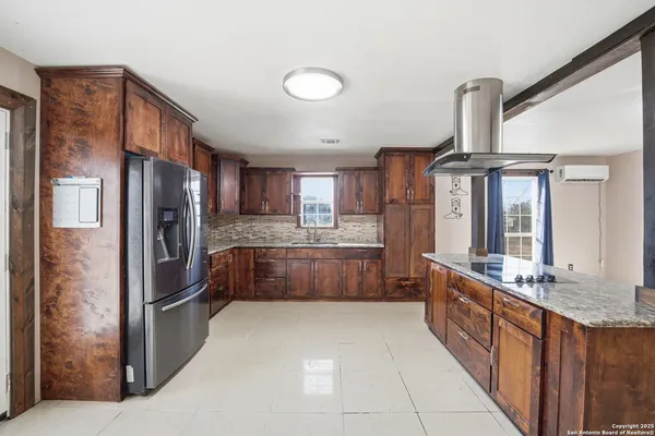 a kitchen with granite countertop a sink and a window