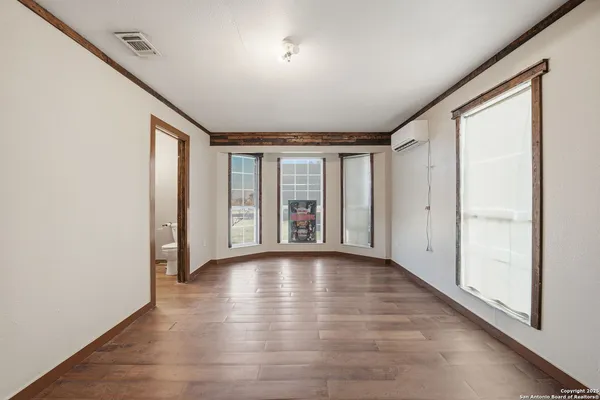 a bathroom with a shower and toilet