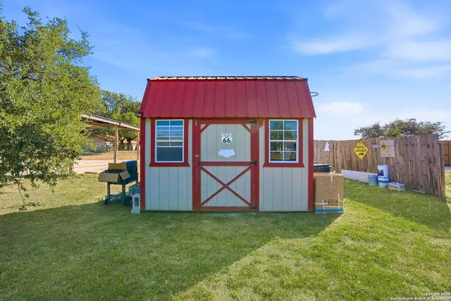 a view of a golf course with an ocean