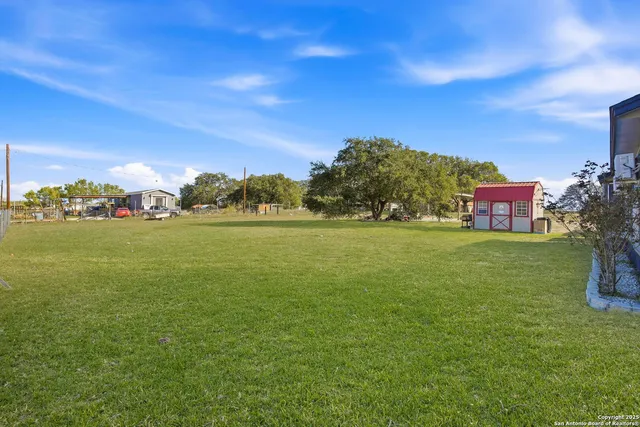 a front view of a house with yard