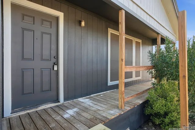 a view of a hallway with a wooden floors