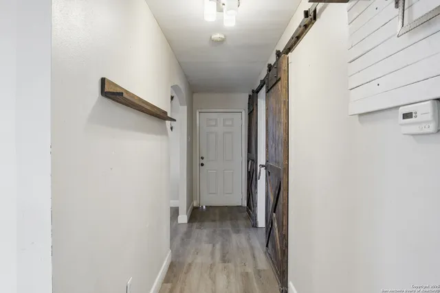 a view of a kitchen with furniture and a window