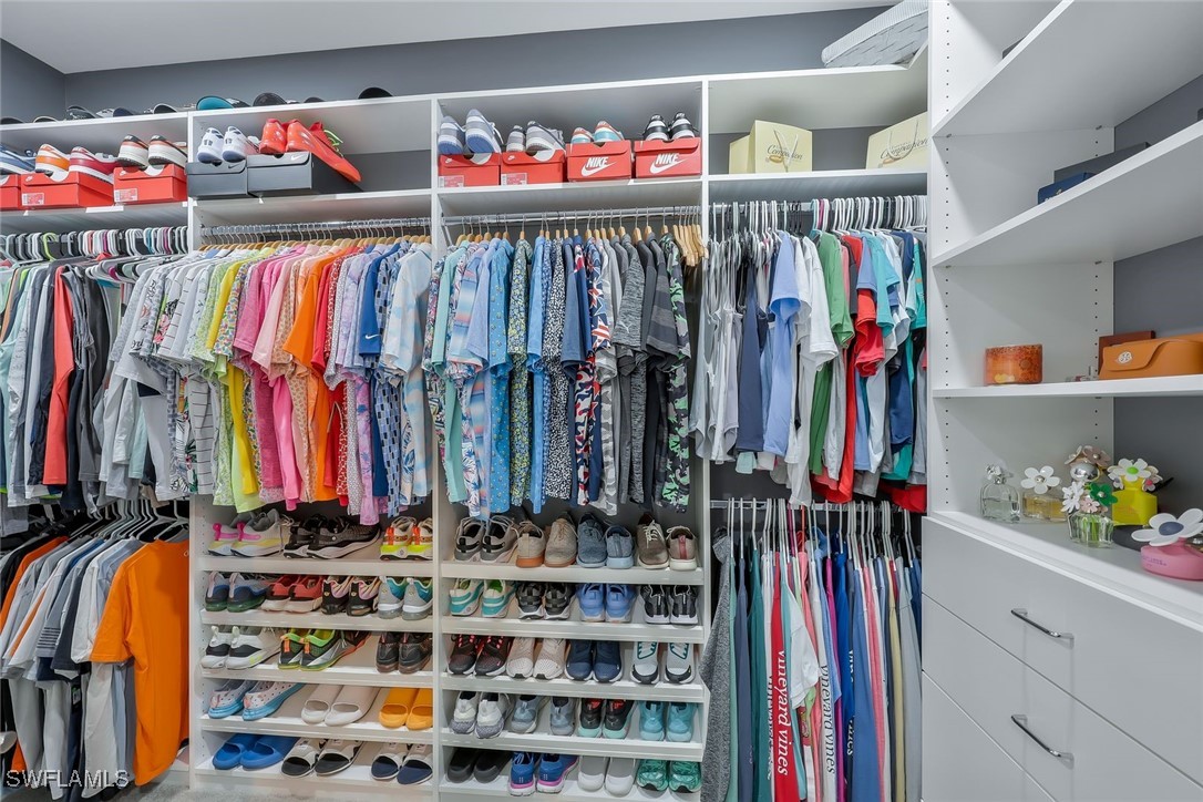 11697 Canopy Loop Fort Myers, FL 33913 - Photo 17 of 50 a view of walk in closet with clothes and shoes