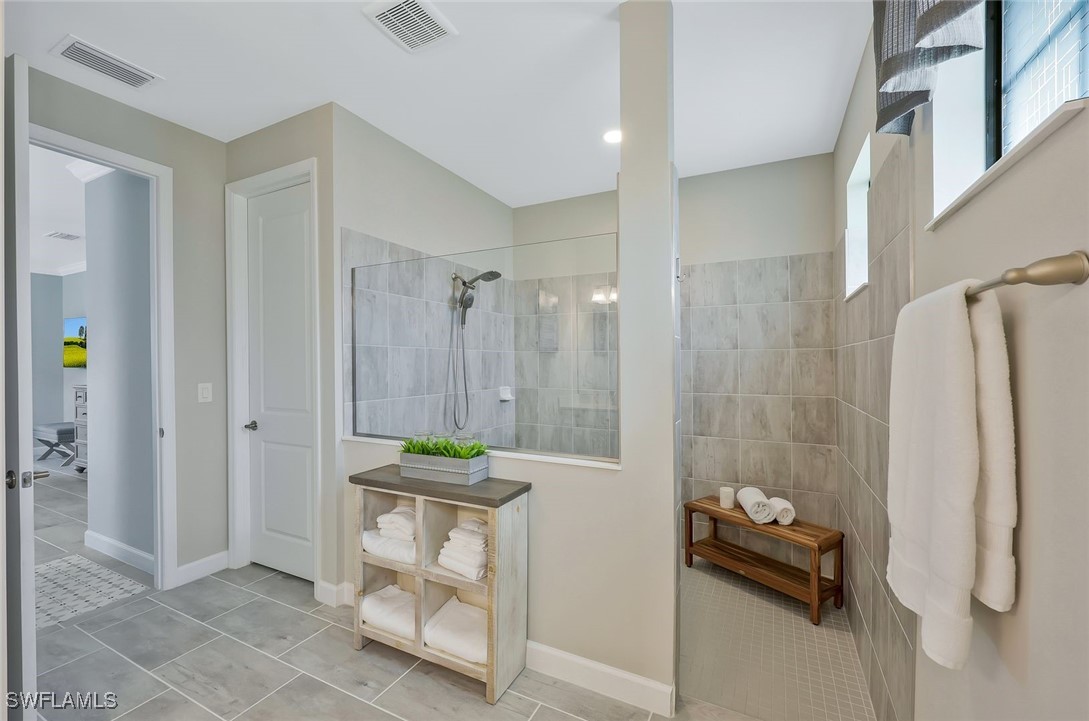 11697 Canopy Loop Fort Myers, FL 33913 - Photo 19 of 50 a bathroom with a shower and a sink