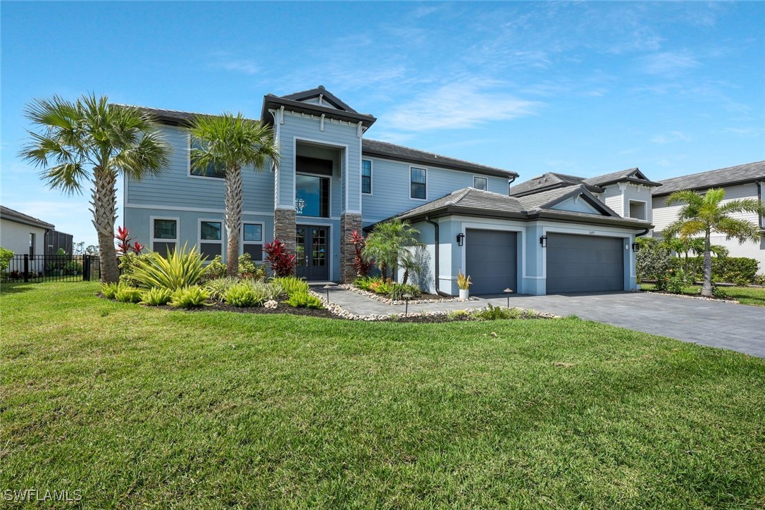 11697 Canopy Loop Fort Myers, FL 33913 - Photo 2 of 50 a front view of a house with garden