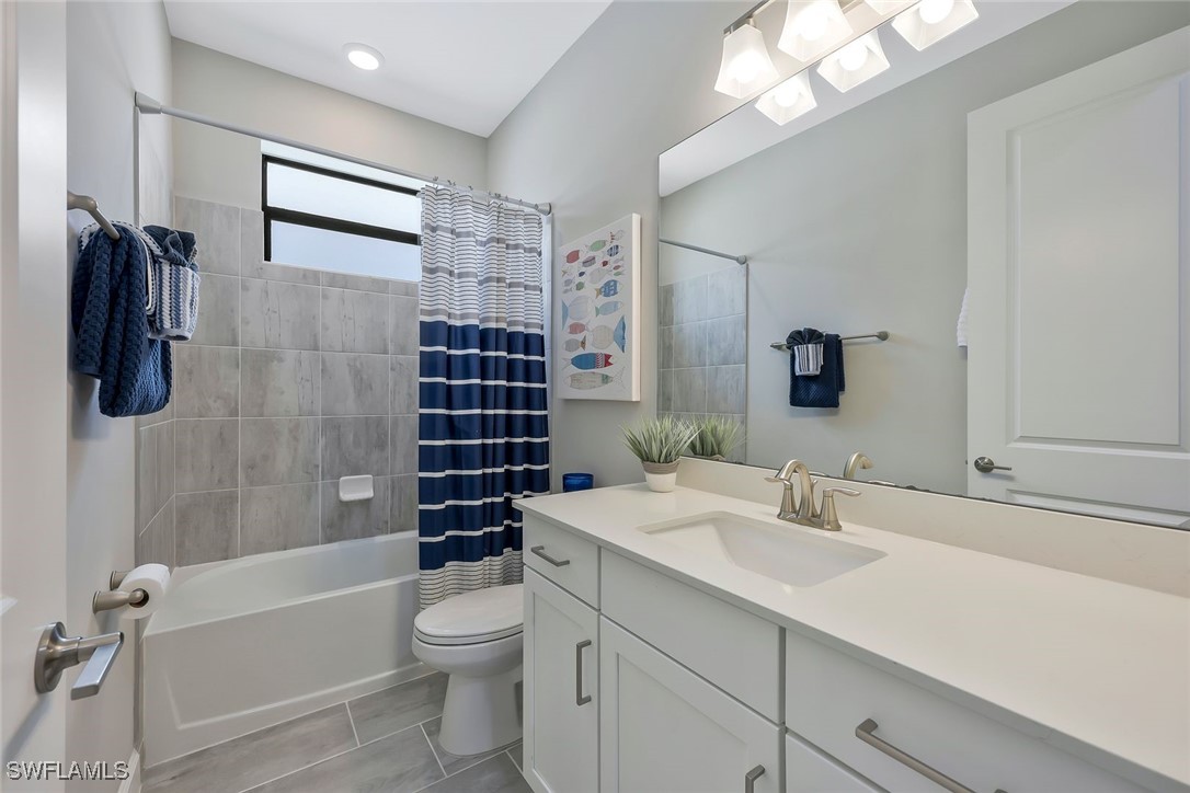 11697 Canopy Loop Fort Myers, FL 33913 - Photo 21 of 50 a bathroom with a sink a toilet and shower