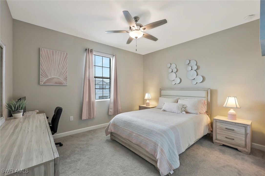 11697 Canopy Loop Fort Myers, FL 33913 - Photo 22 of 50 a bedroom with a bed and a chandelier