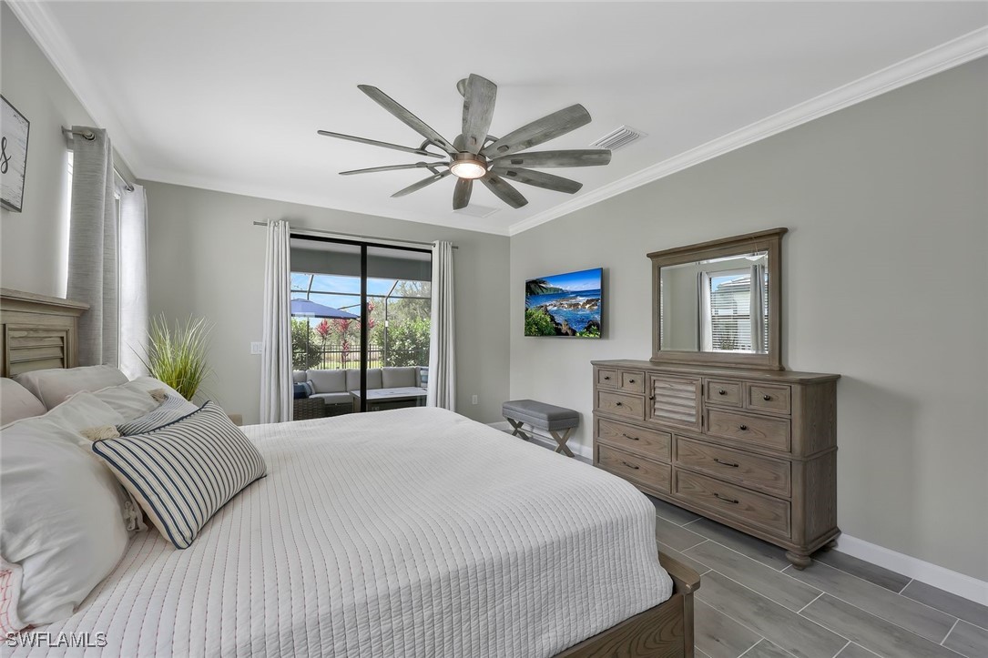 11697 Canopy Loop Fort Myers, FL 33913 - Photo 28 of 50 a bedroom with a large bed and a window