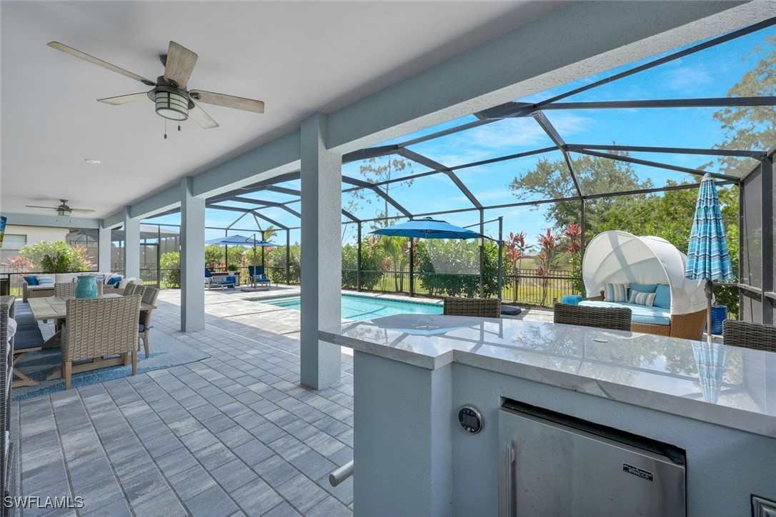 11697 Canopy Loop Fort Myers, FL 33913 - Photo 32 of 50 a kitchen with a sink and a large window