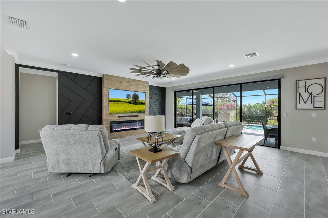 11697 Canopy Loop Fort Myers, FL 33913 - Photo 6 of 50 a living room with furniture and a flat screen tv