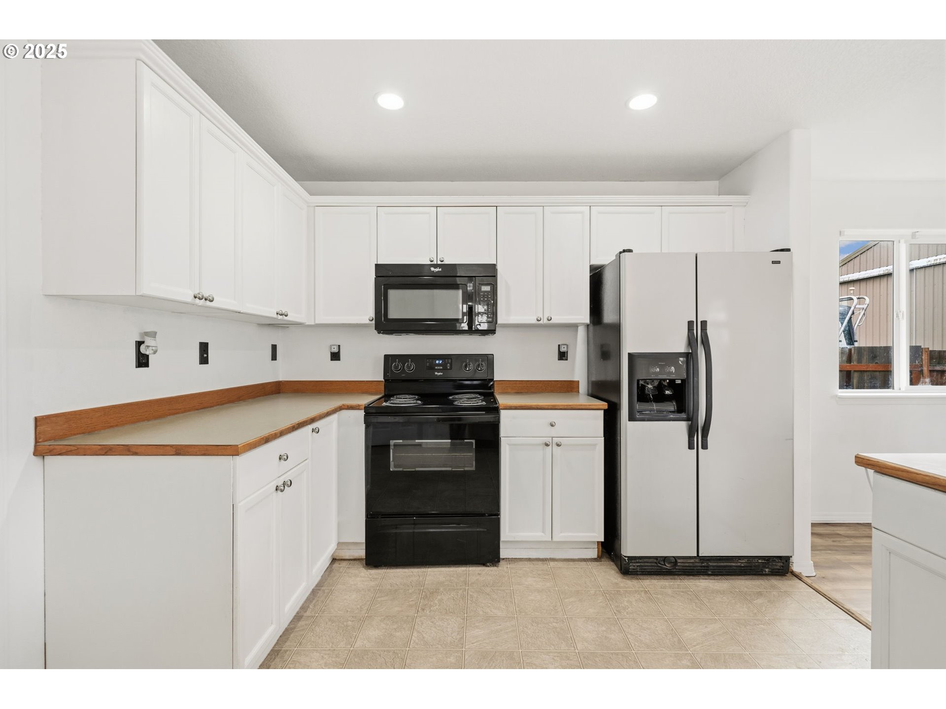 620 Studer Place Gervais, OR 97026 - Photo 13 of 33 a kitchen with stainless steel appliances a refrigerator sink and cabinets