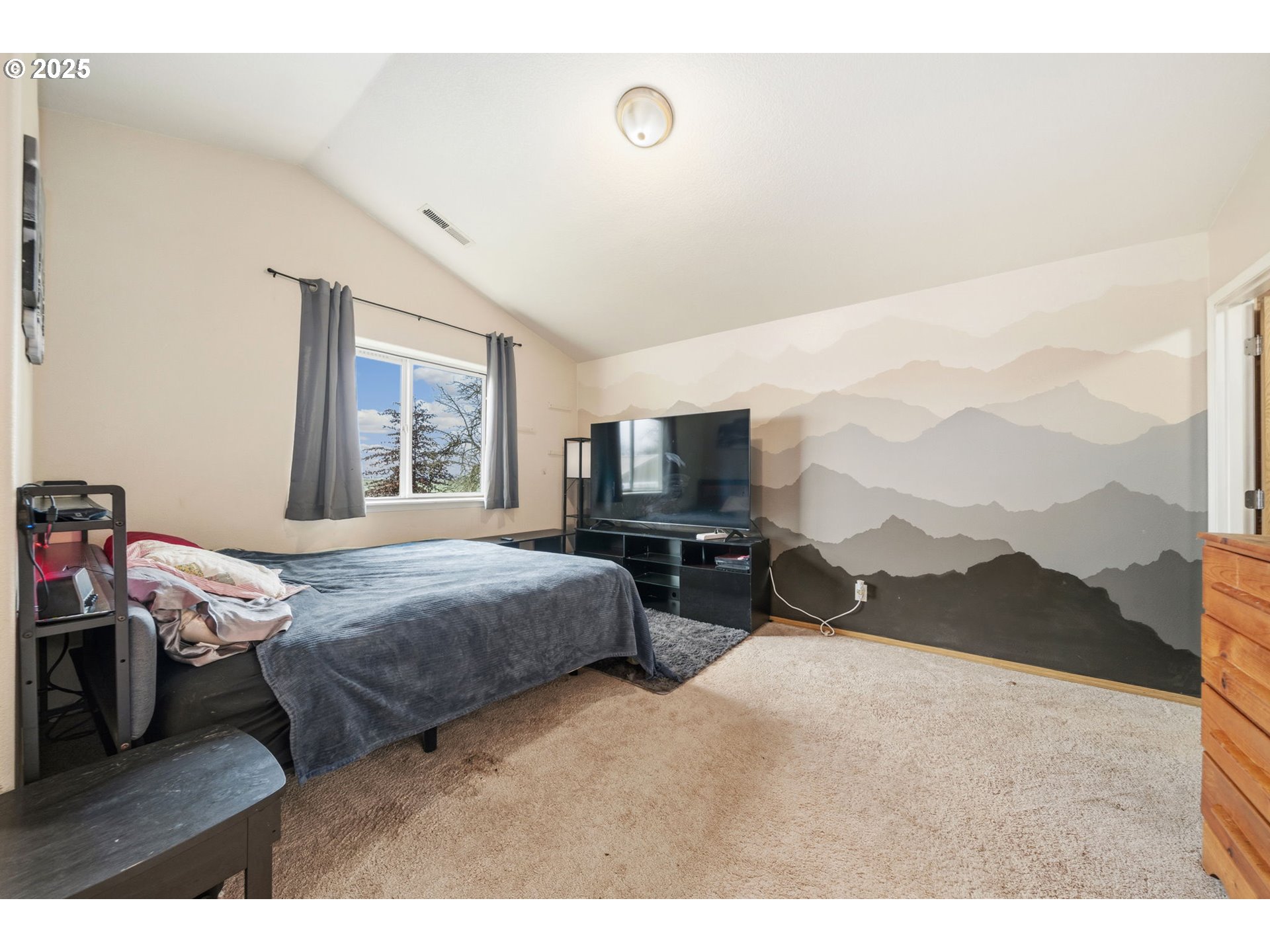 620 Studer Place Gervais, OR 97026 - Photo 16 of 33 a bedroom with a bed a large window and dresser