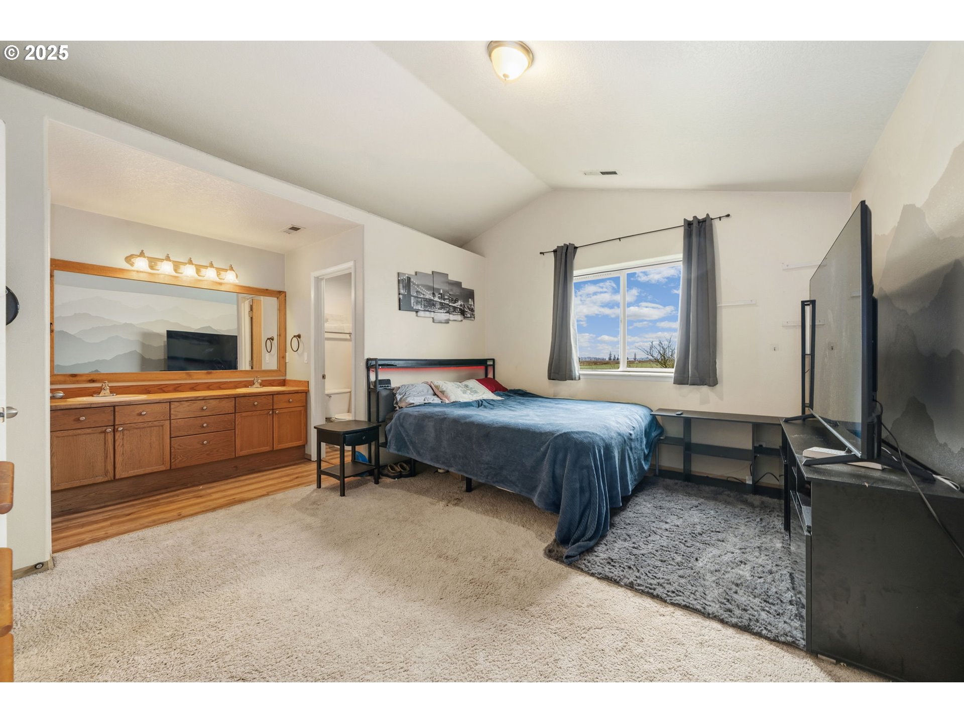 620 Studer Place Gervais, OR 97026 - Photo 17 of 33 a bedroom with a bed and a flat screen tv