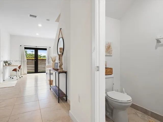 a bathroom with a sink toilet and tub