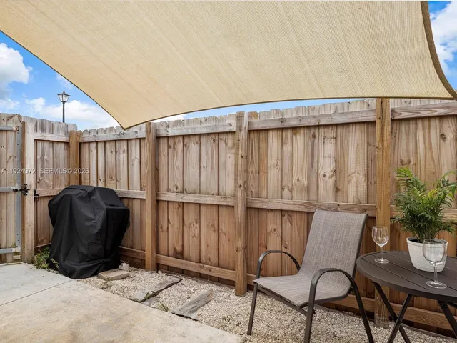 a view of a room with furniture and a potted plant