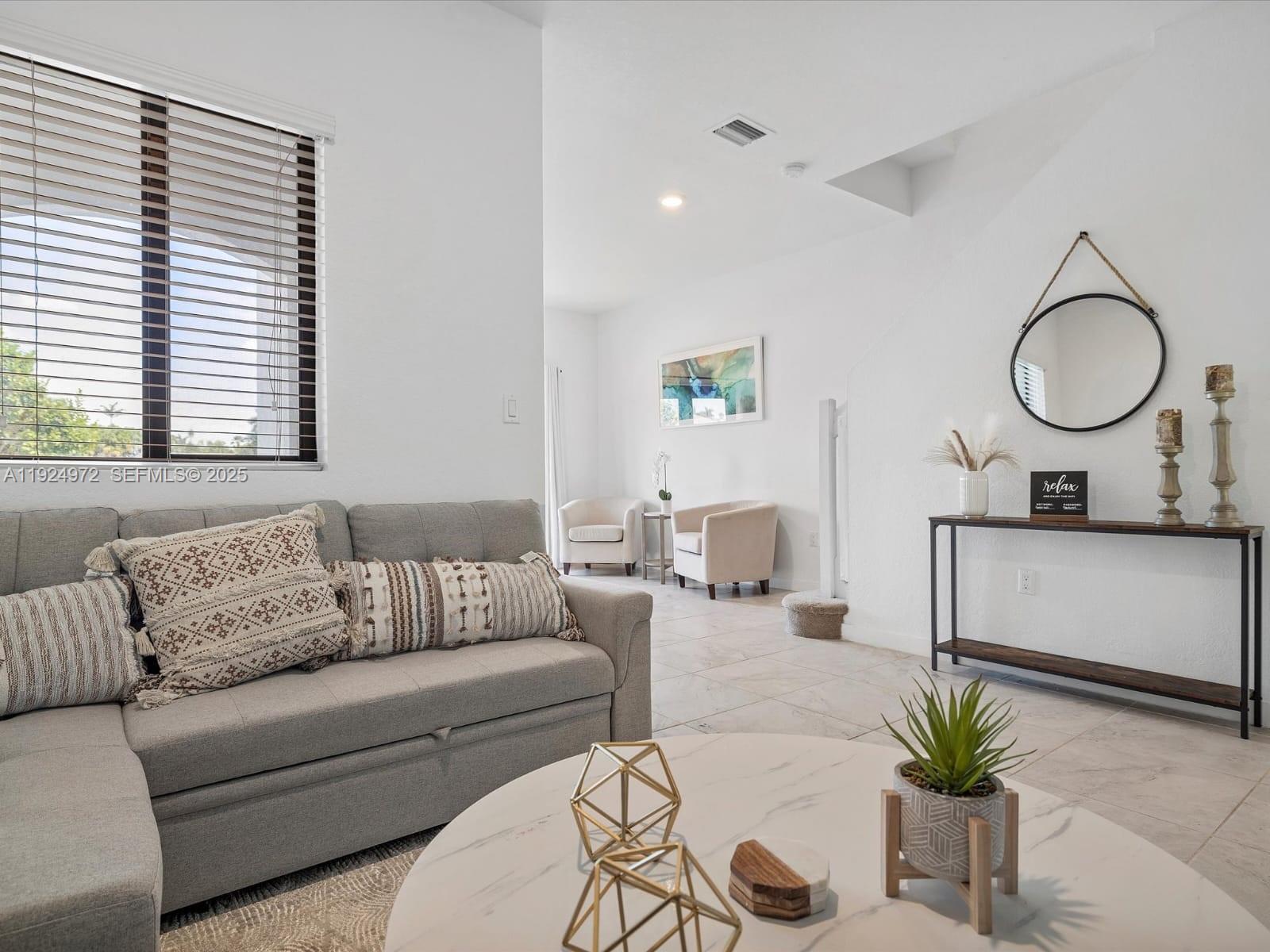 13344 Southwest 250th Street Homestead, FL 33032 - Photo 15 of 20 a living room with furniture and a potted plant
