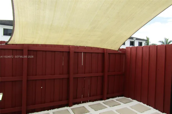 a wooden door in a backyard