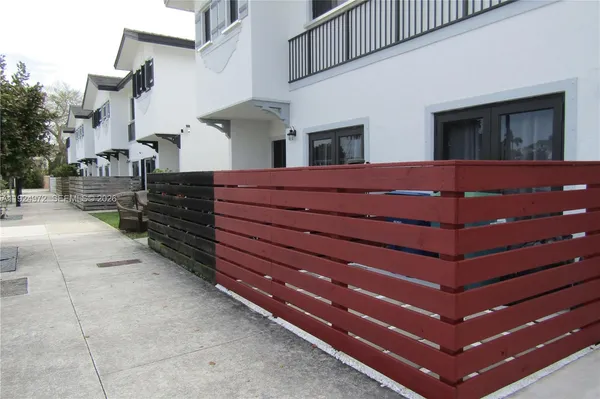 a view of a house with a flower garden