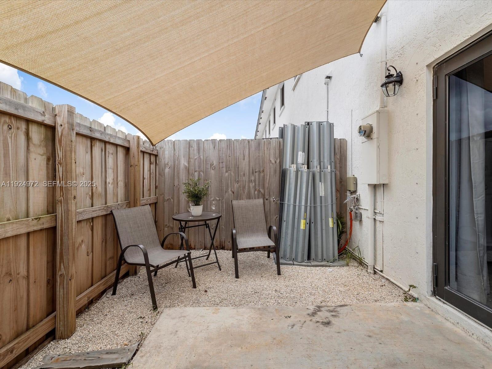 13344 Southwest 250th Street Homestead, FL 33032 - Photo 18 of 20 a view of two chairs in the patio