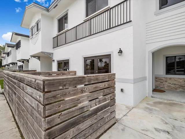 a view of living room kitchen and entryway