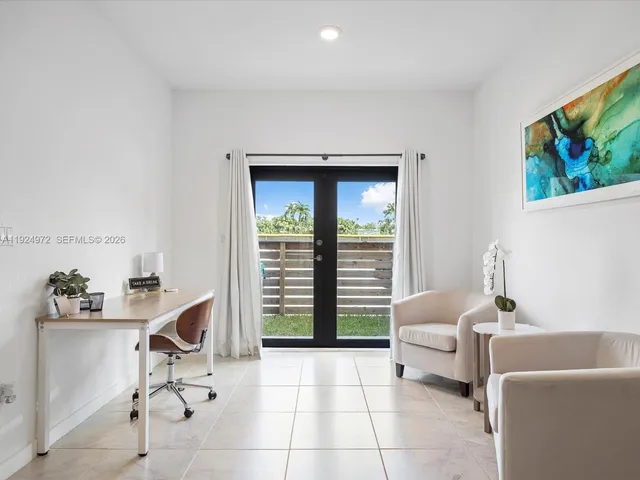 a workspace with furniture and window