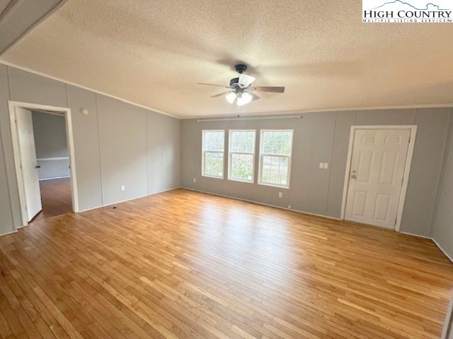 68 Rhoneys View Road Newland, NC 28657 - Photo 19 of 37 a view of empty room with wooden floor and fan