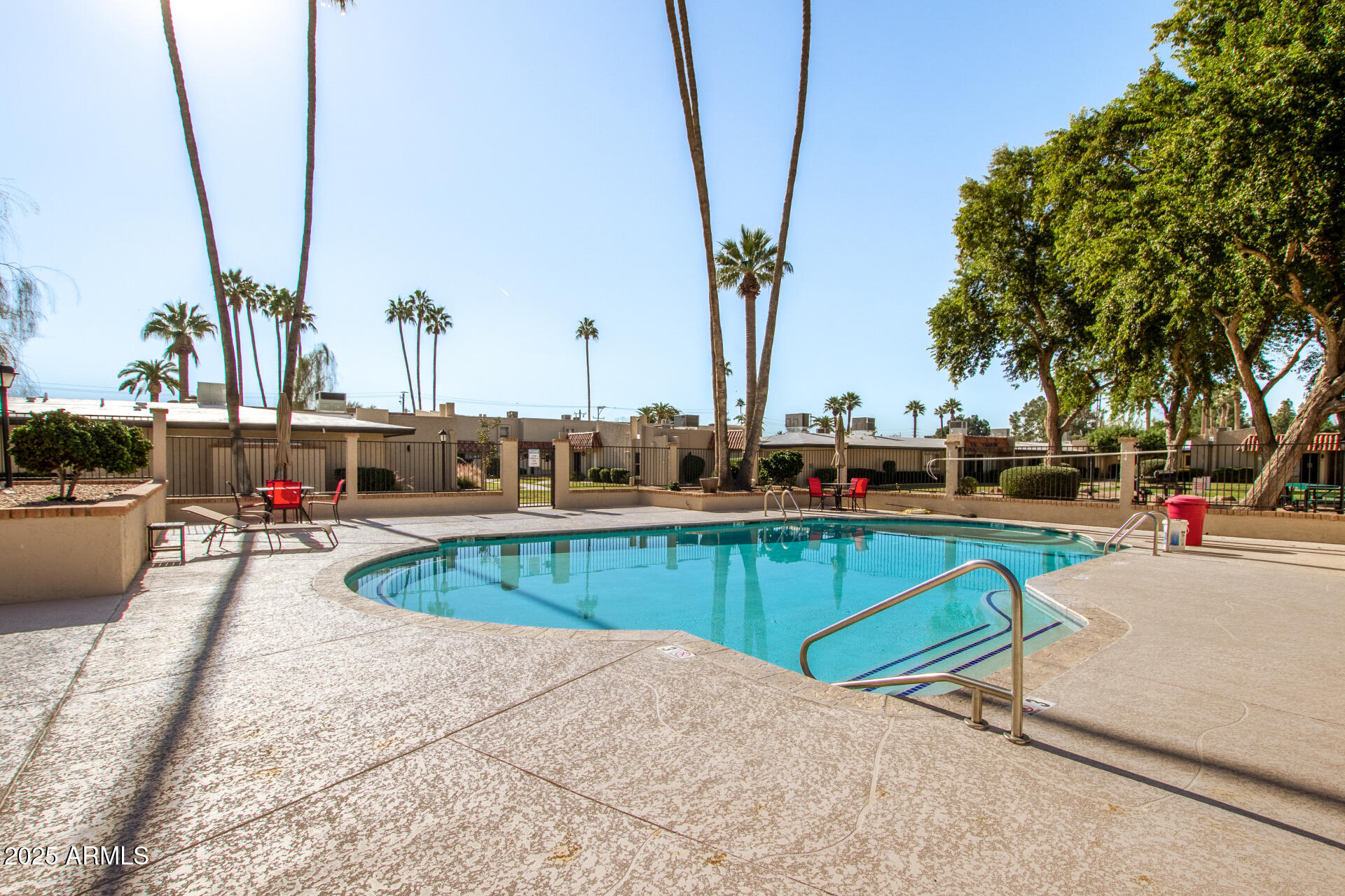 1320 East Bethany Home Road, Unit 54 Phoenix, AZ 85014 - Photo 25 of 37 a view of swimming pool with outdoor seating