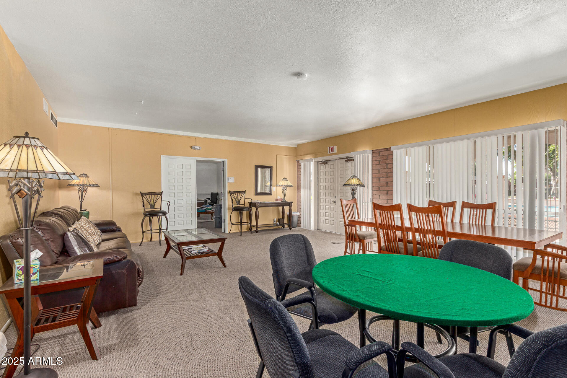 1320 East Bethany Home Road, Unit 54 Phoenix, AZ 85014 - Photo 33 of 37 a view of a dining room with furniture and a large window