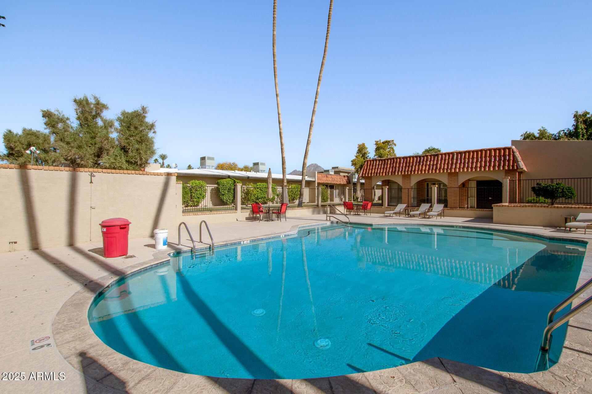 1320 East Bethany Home Road, Unit 54 Phoenix, AZ 85014 - Photo 34 of 37 a view of a swimming pool with a patio