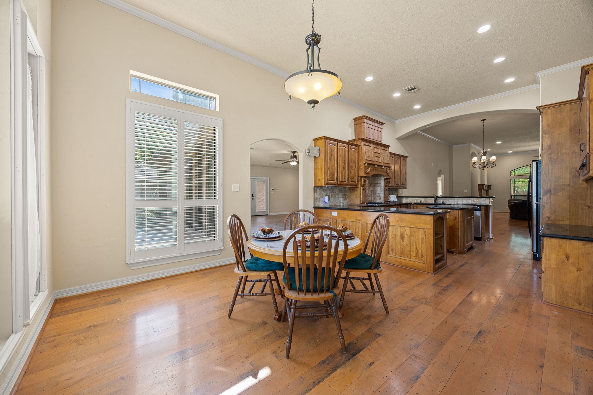 28618 Benders Crossing Drive Spring, TX 77386 - Photo 12 of 46 Inviting breakfast area conveniently located off the kitchen, featuring hardwood flooring, recessed lighting, and easy access to surrounding living spaces. A perfect spot for casual dining or morning coffee.