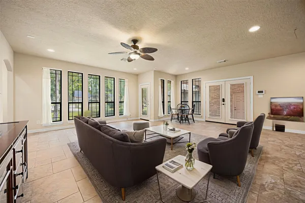 a view of an outside dining space with furniture window and outside view