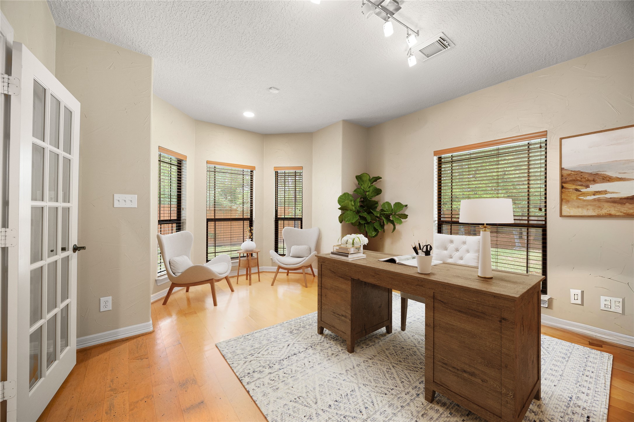 28618 Benders Crossing Drive Spring, TX 77386 - Photo 29 of 46 Dedicated study with hardwood flooring, multiple windows, and French door entry. Bright, versatile space ideal for a home office, reading room, or flex space.