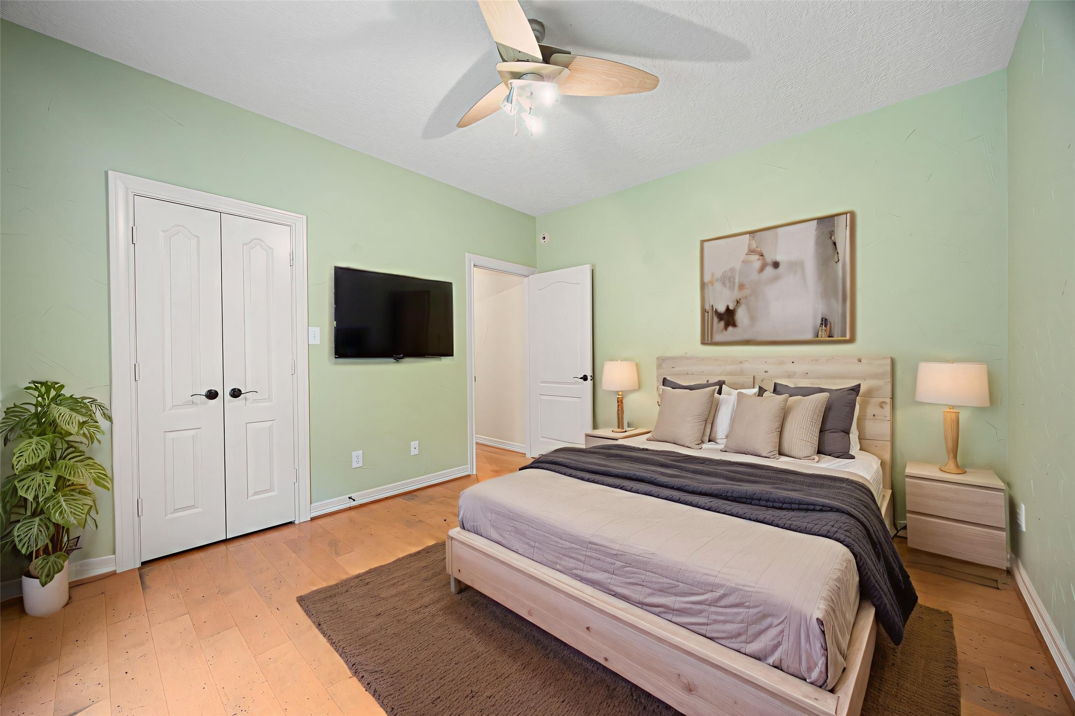 28618 Benders Crossing Drive Spring, TX 77386 - Photo 34 of 46 Alternate view of the secondary bedroom showcasing double-door closet, ceiling fan, and ample wall space. Ideal for a guest room, home office, or flex bedroom.