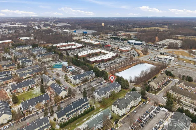 an aerial view of residential building with parking space