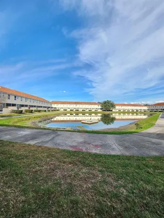 a utility room with water heater and storage