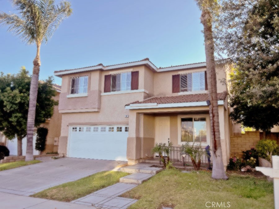 7358 Freedom Place Rancho Cucamonga, CA 91730 - Photo 1 of 1 a front view of a house with garden