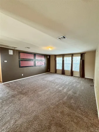 a view of large room with window