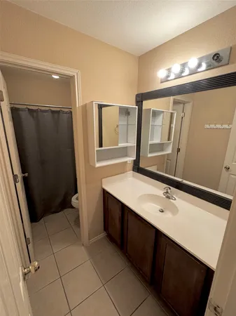 a bathroom with a double vanity sink and mirror